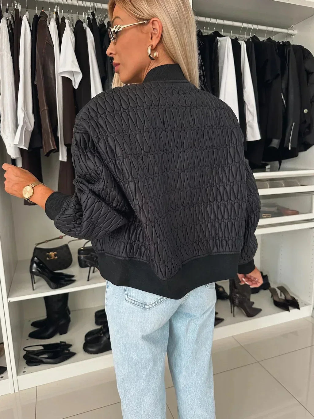 Women's quilted zip-front bomber jacket with long sleeves