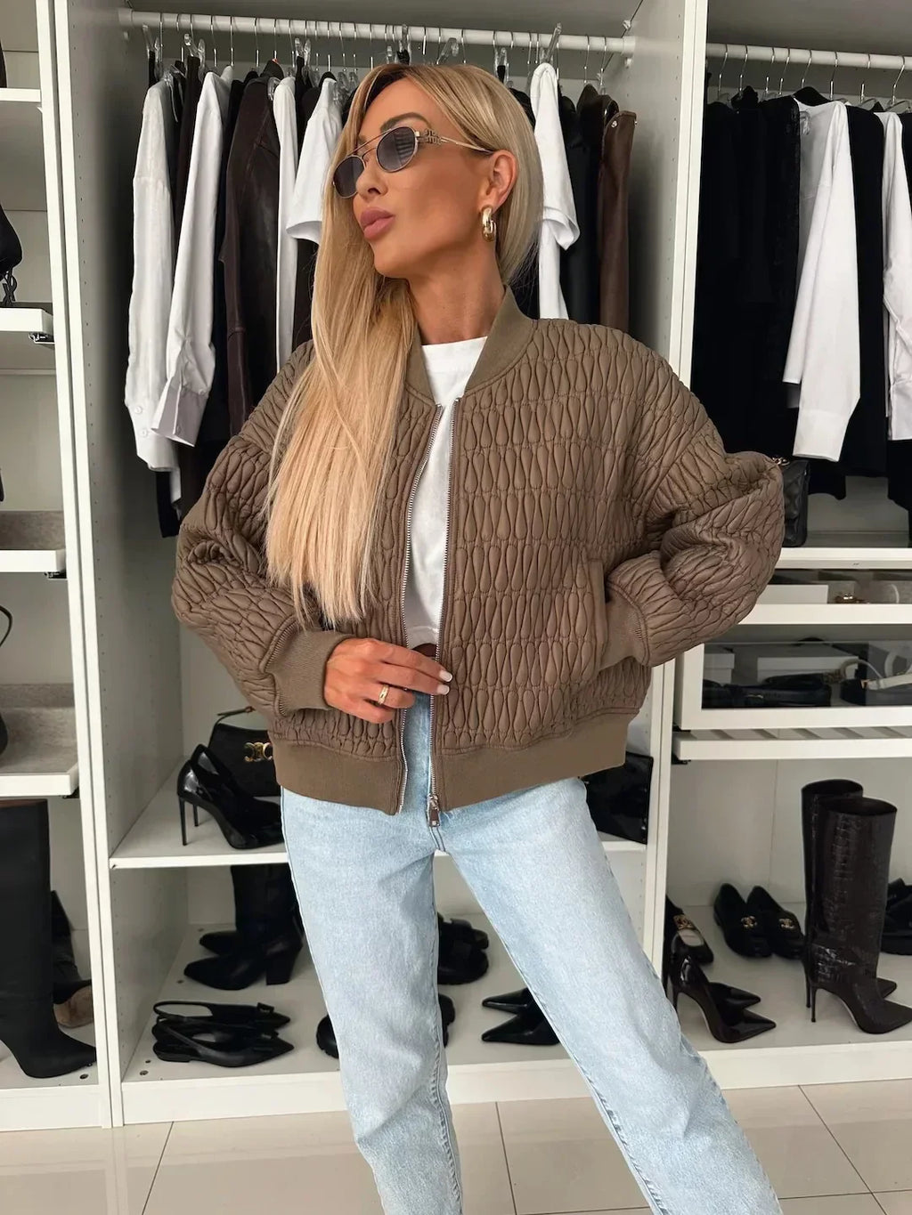 Women's quilted zip-front bomber jacket with long sleeves