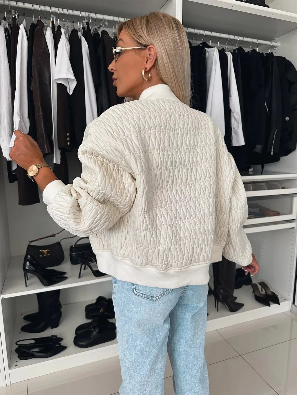 Women's quilted zip-front bomber jacket with long sleeves