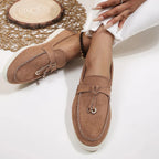Women's slip-on flatform loafers with metal eyelet detail