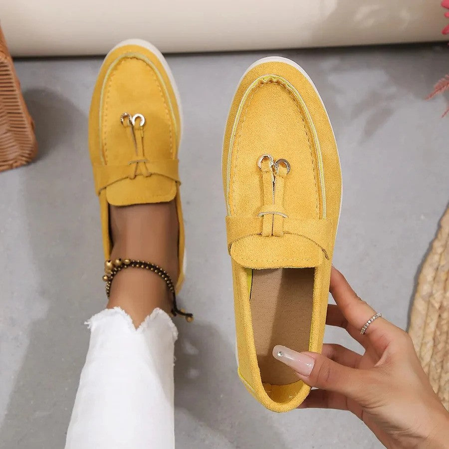 Women's slip-on flatform loafers with metal eyelet detail
