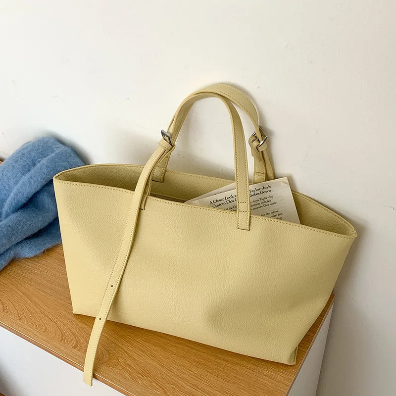 Women's structured open-top tote bag with adjustable crossbody strap