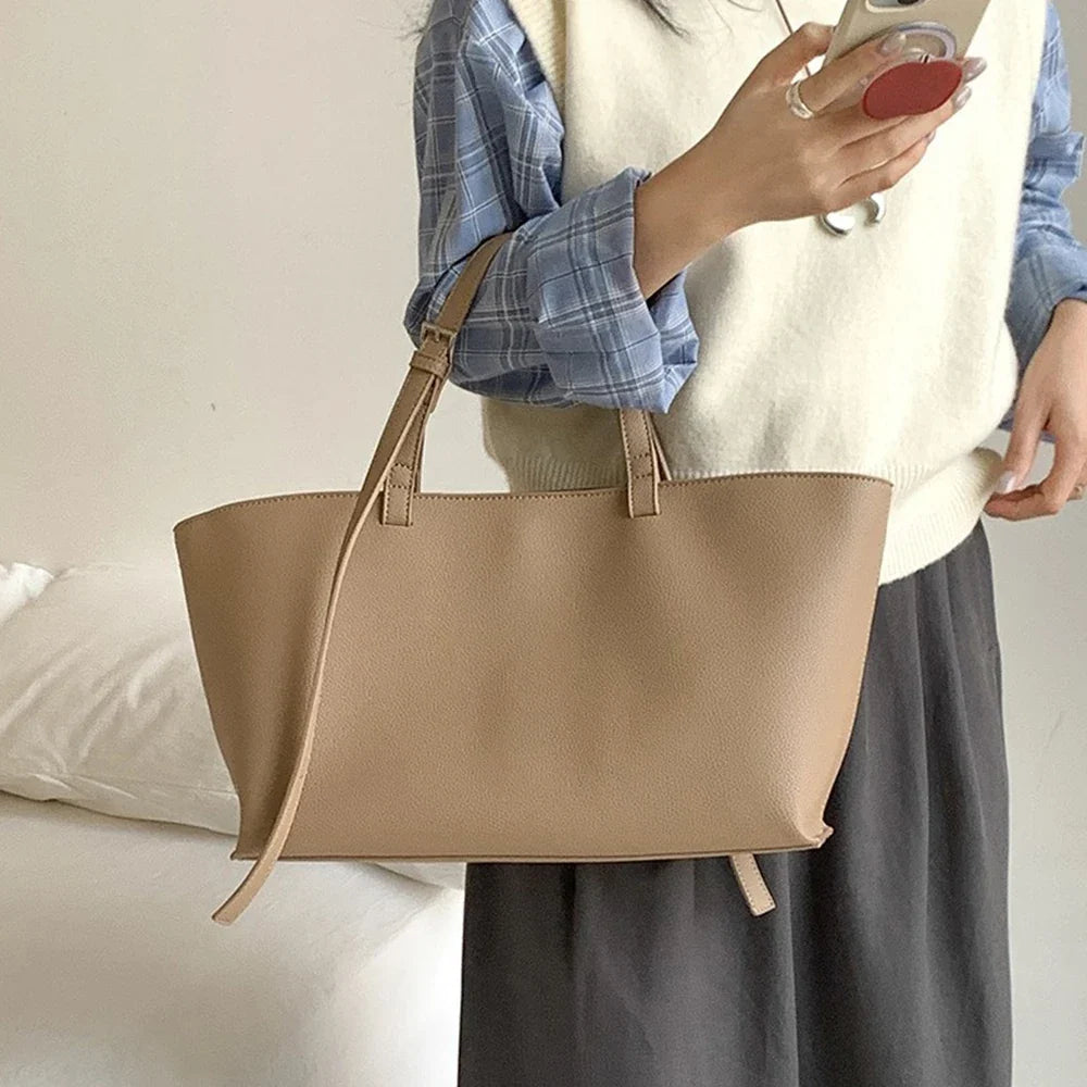 Women's structured open-top tote bag with adjustable crossbody strap