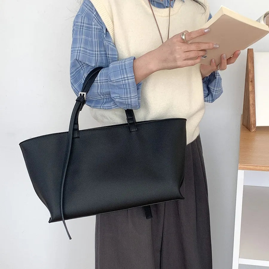 Women's structured open-top tote bag with adjustable crossbody strap