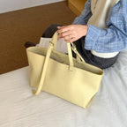 Women's structured open-top tote bag with adjustable crossbody strap