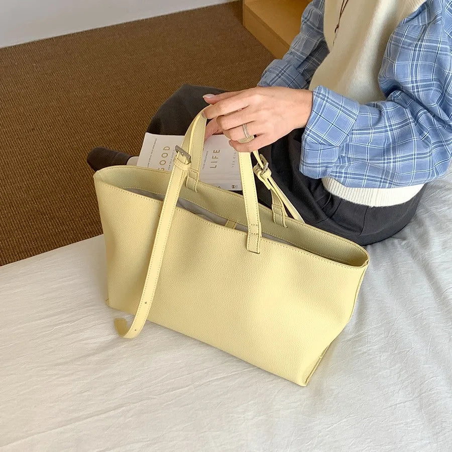 Women's structured open-top tote bag with adjustable crossbody strap