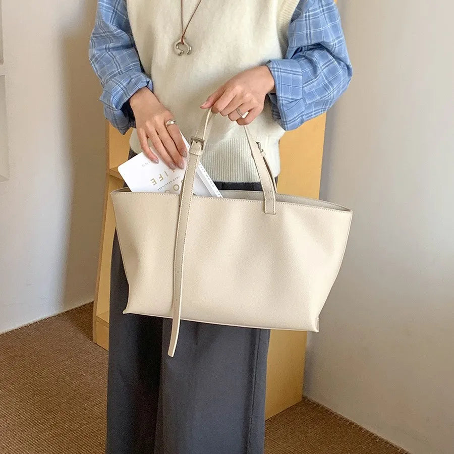 Women's structured open-top tote bag with adjustable crossbody strap