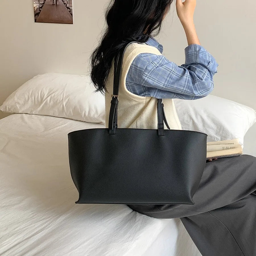 Women's structured open-top tote bag with adjustable crossbody strap