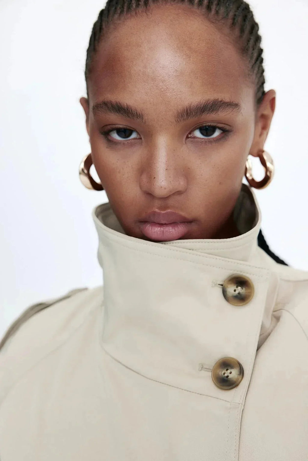 Women's trench coat with high collar and tie belt