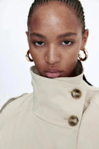 Women's trench coat with high collar and tie belt