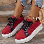 Women's two-tone low-top platform sneakers with lace-up front