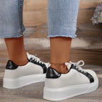 Women's two-tone low-top platform sneakers with lace-up front