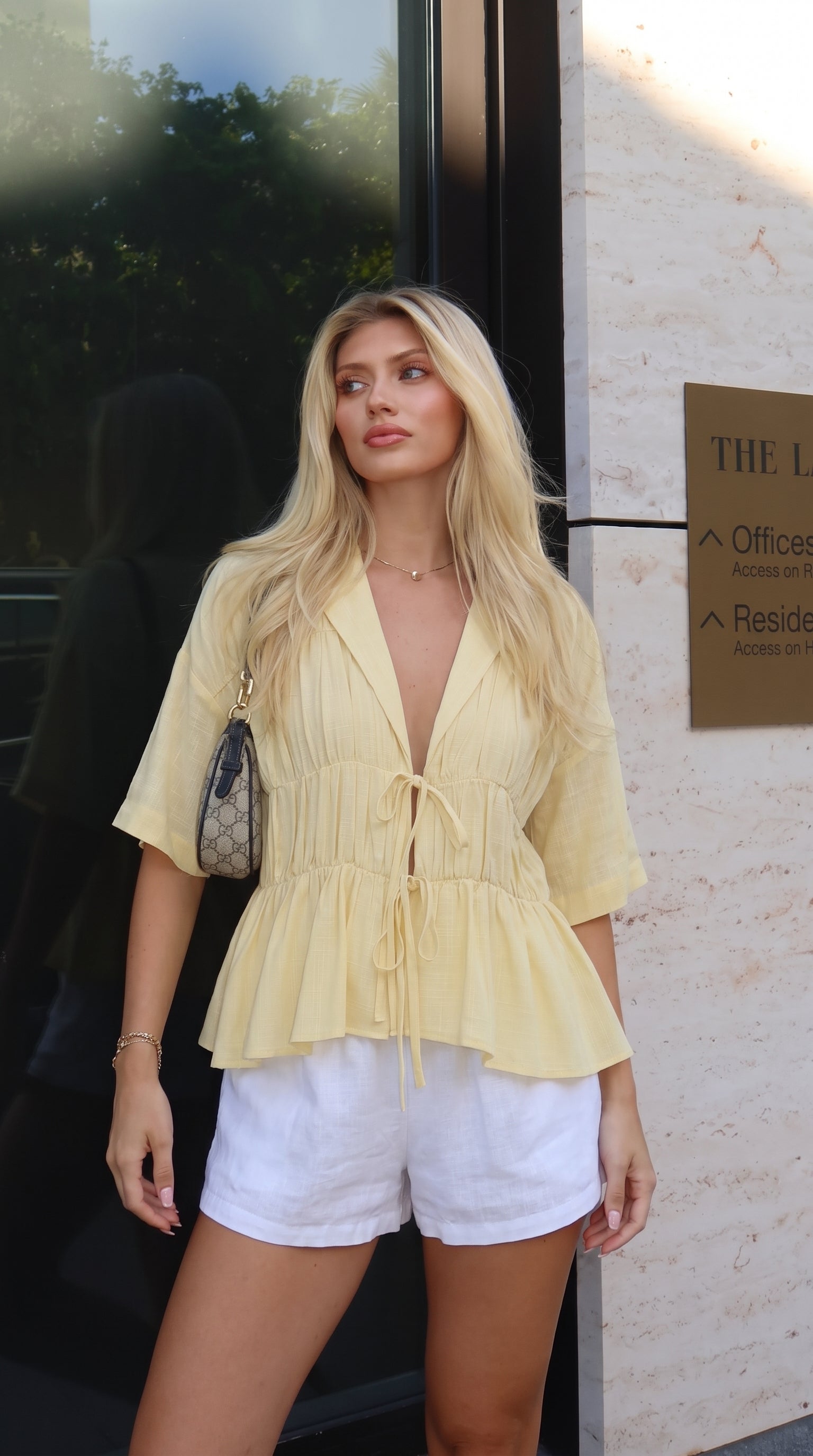 Women's tie-front peplum blouse with collared neckline