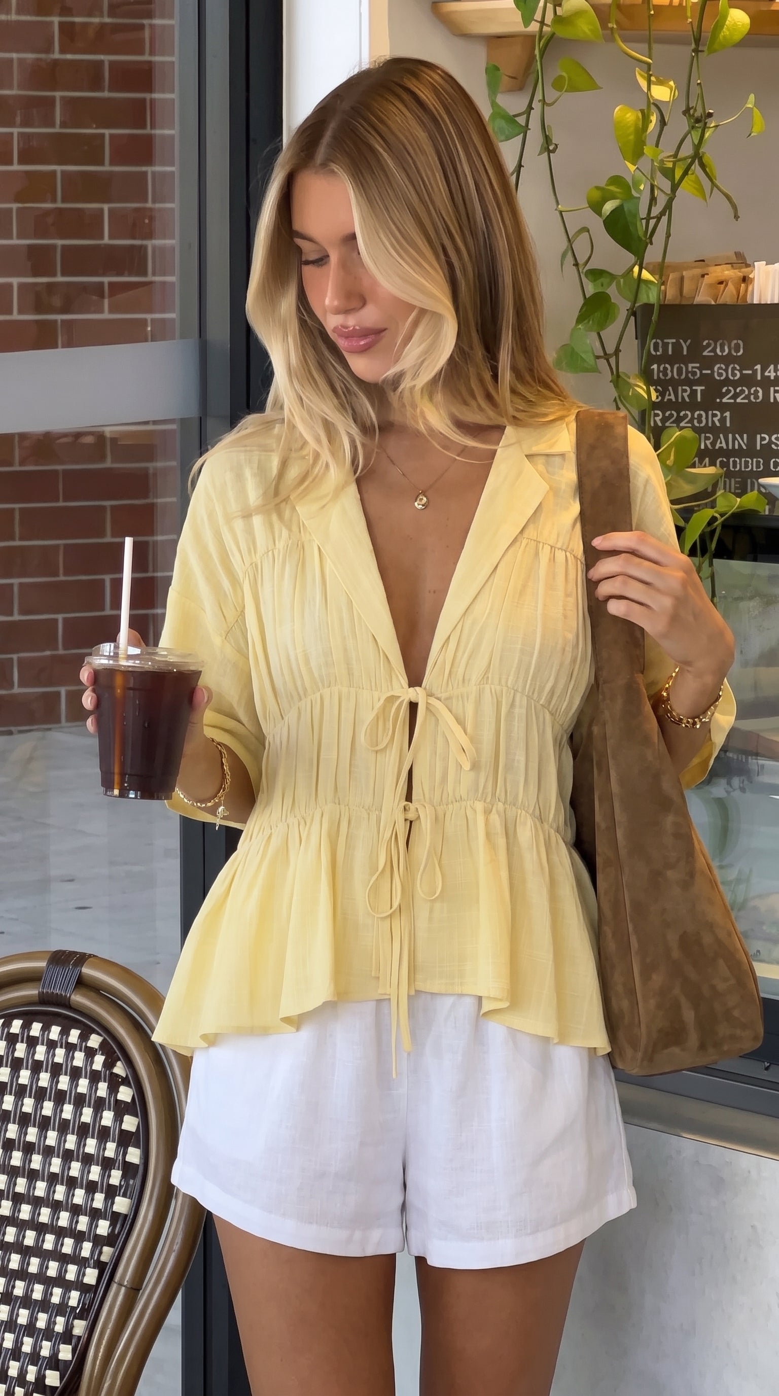 Women's tie-front peplum blouse with collared neckline